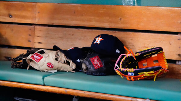 May 16, 2022; Boston, Massachusetts, USA; A general view of gloves and Houston Astros hats prior to the game against the Boston Red Sox at Fenway Park.