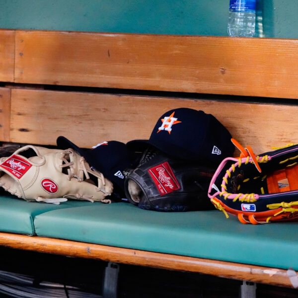 May 16, 2022; Boston, Massachusetts, USA; A general view of gloves and Houston Astros hats prior to the game against the Boston Red Sox at Fenway Park.