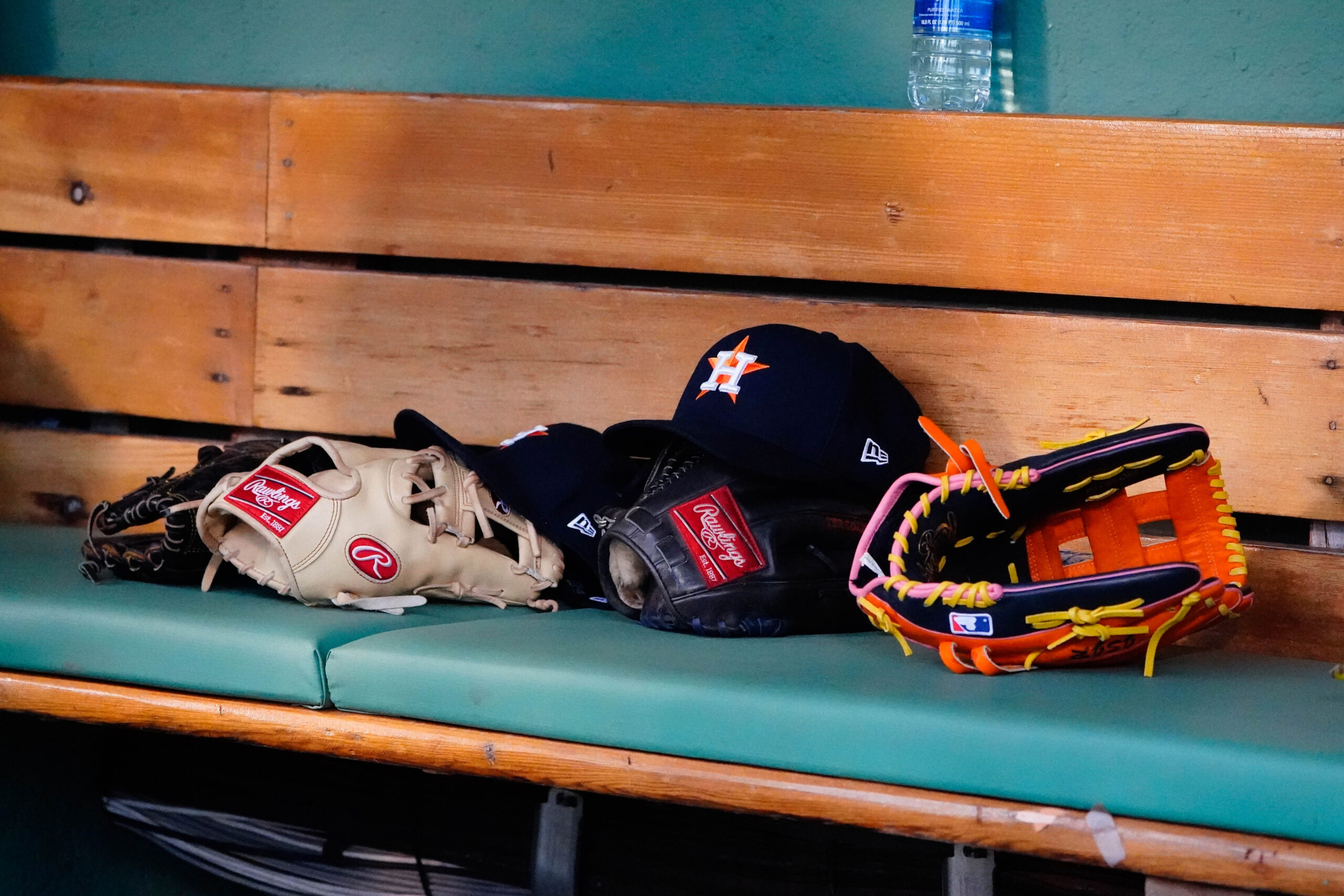 May 16, 2022; Boston, Massachusetts, USA; A general view of gloves and Houston Astros hats prior to the game against the Boston Red Sox at Fenway Park.