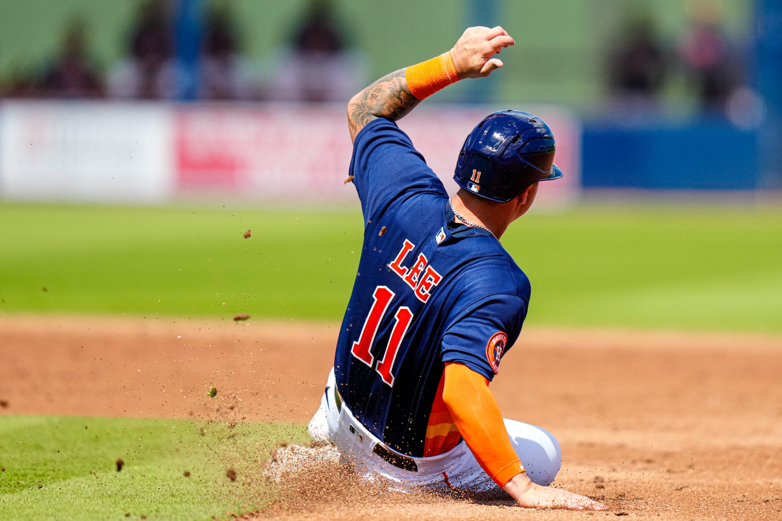 Mar 12, 2023; West Palm Beach, Florida, USA; Houston Astros catcher Korey Lee (11) attempts to slide into second base against the Miami Marlins during the third inning at The Ballpark of the Palm Beaches.