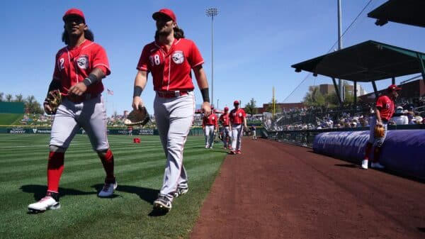 Cincinnati Reds minor league outfielder Quincy McAfee, left, and catcher Garrett Wolforth walks to the dugout before a spring training game against the Chicago Cubs, Monday, March 21, 2022, at Sloan Park in Mesa, Ariz. Cincinnati Reds At Chicago Cubs March 21 0136